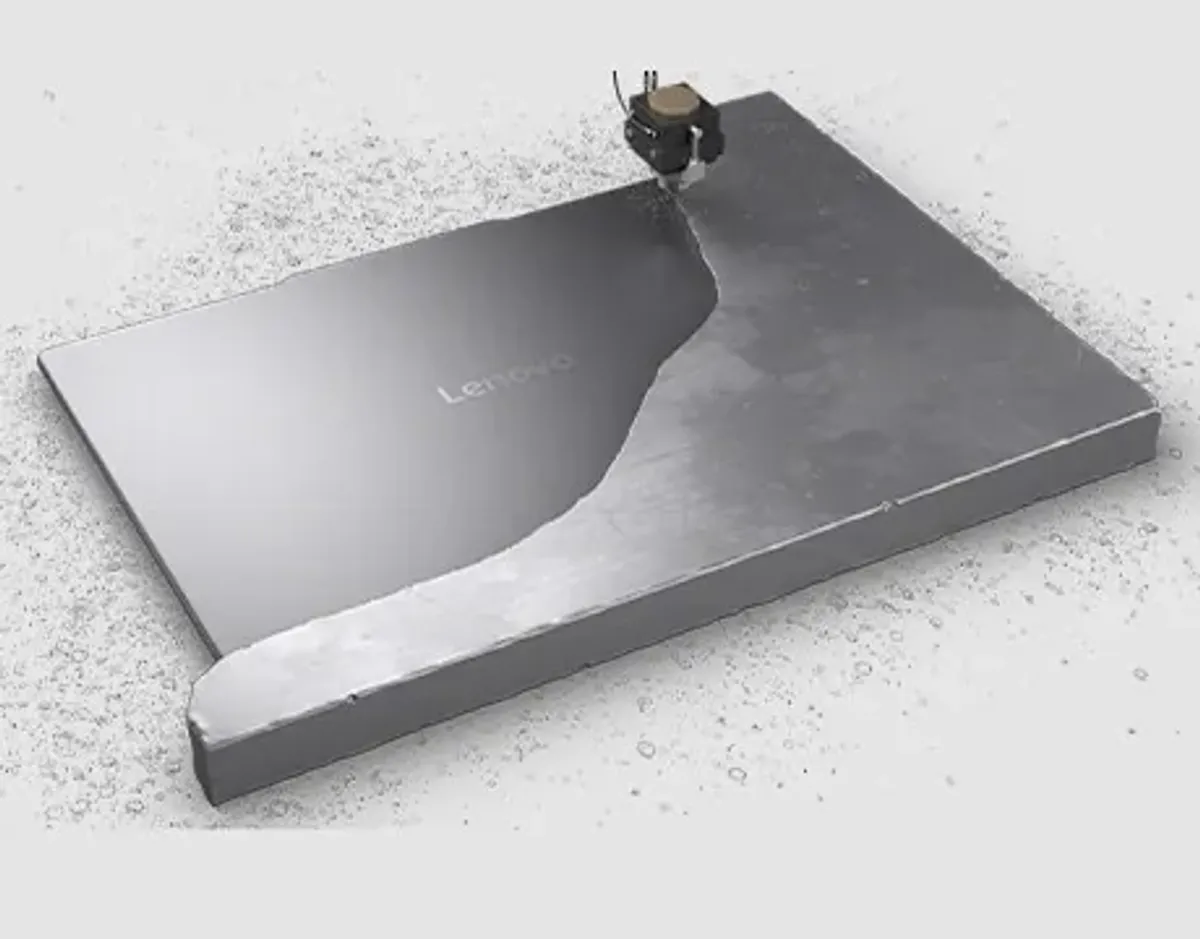 A closed Yoga 9i 2-in-1 Gen 10 Aura Edition (14 Intel) emerges from an iron block.