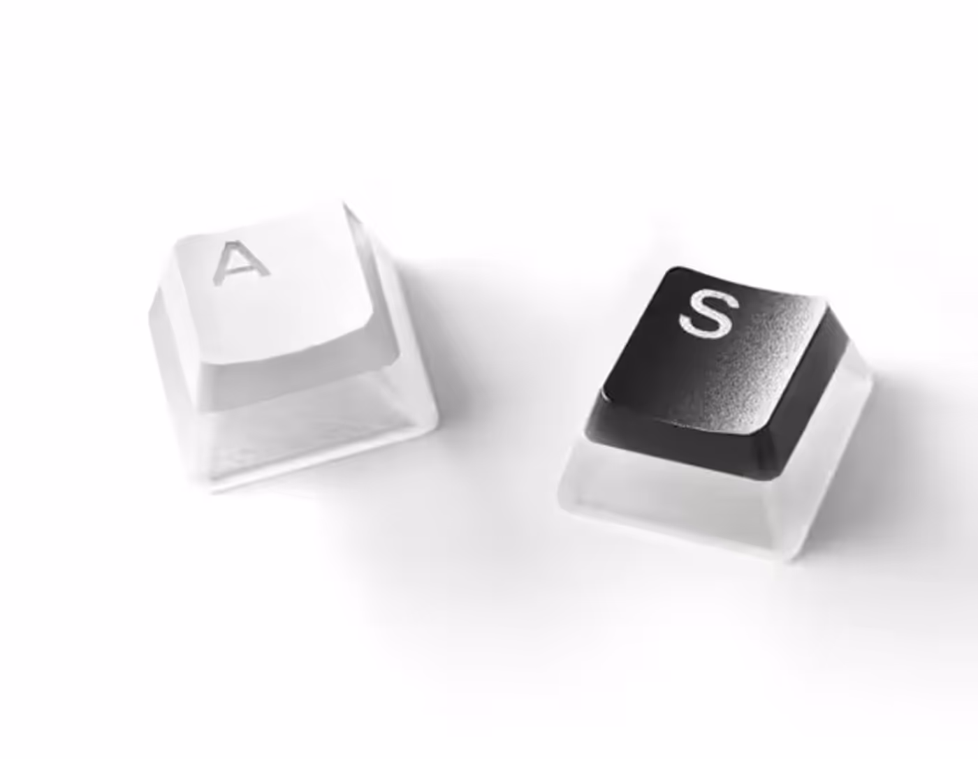 SteelSeries Prismcaps shown in the black and white colour options