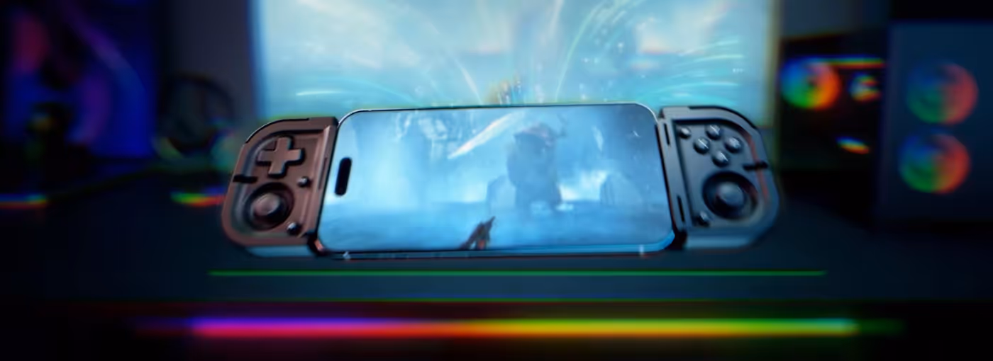 A gaming phone with attached controllers displays a sci-fi game, with colorful LED lighting on a desk and speakers in the background.