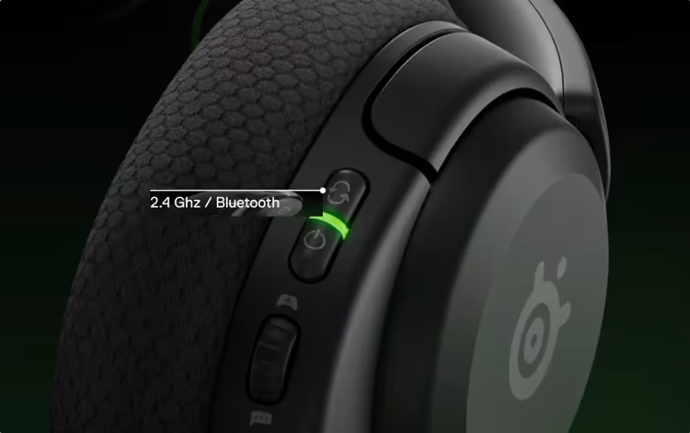 A view of a single Arctis Nova 5 headphone with visible side buttons for Bluetooth and 2.4Ghz options.