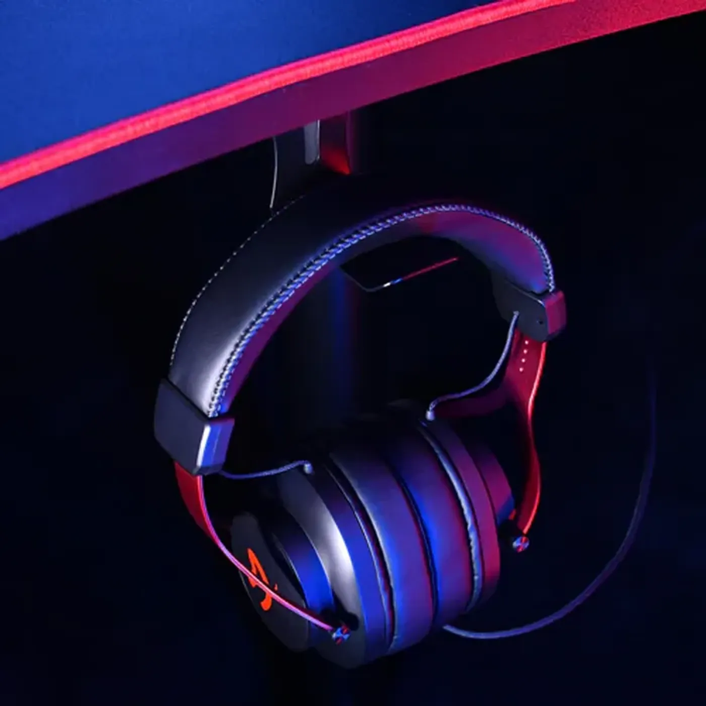 Headset hanger attached under gaming desk