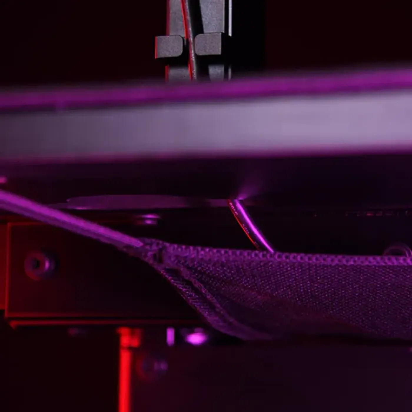 Cable management system with surface cutouts on Arena Moto desk
