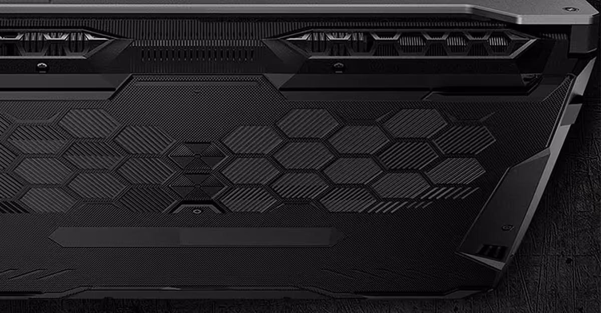 Laptop base featuring honeycomb textured grip and functional cooling ventilation cutouts