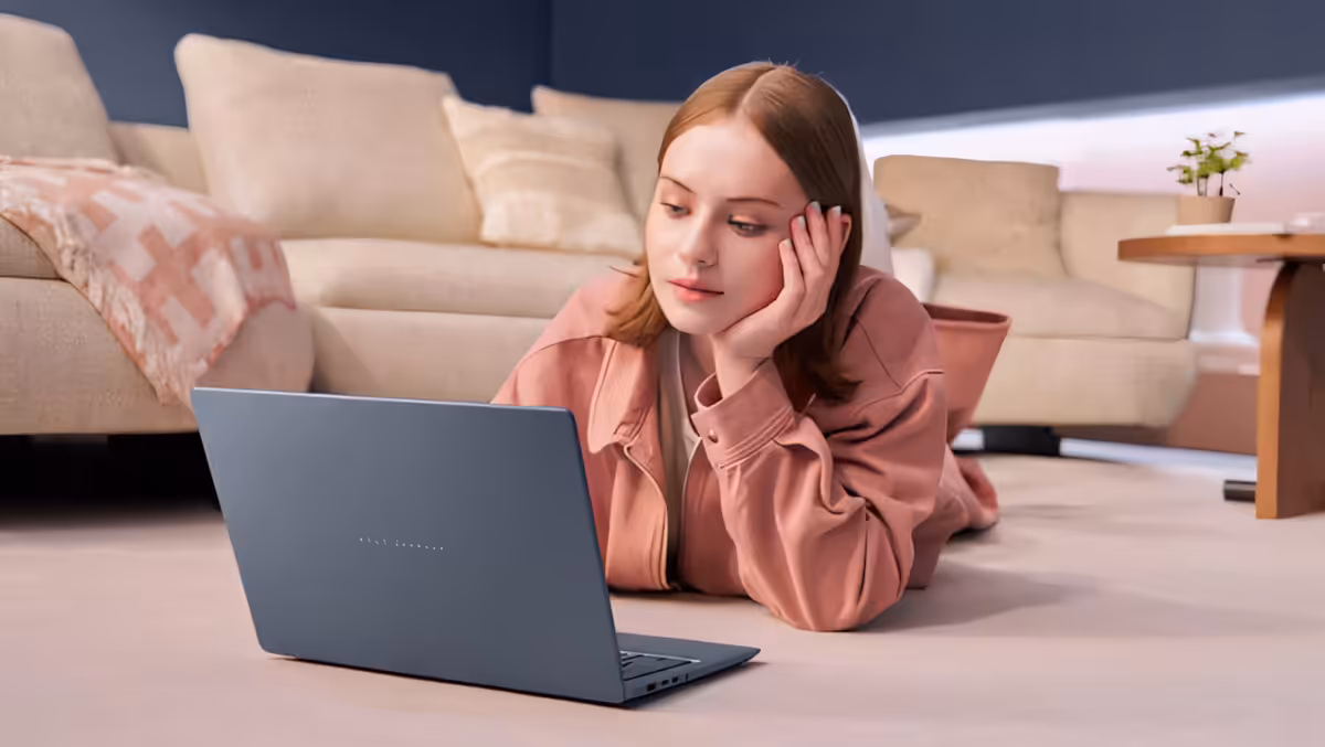 Person using ASUS Zenbook 14 with immersive audio from built-in speakers
