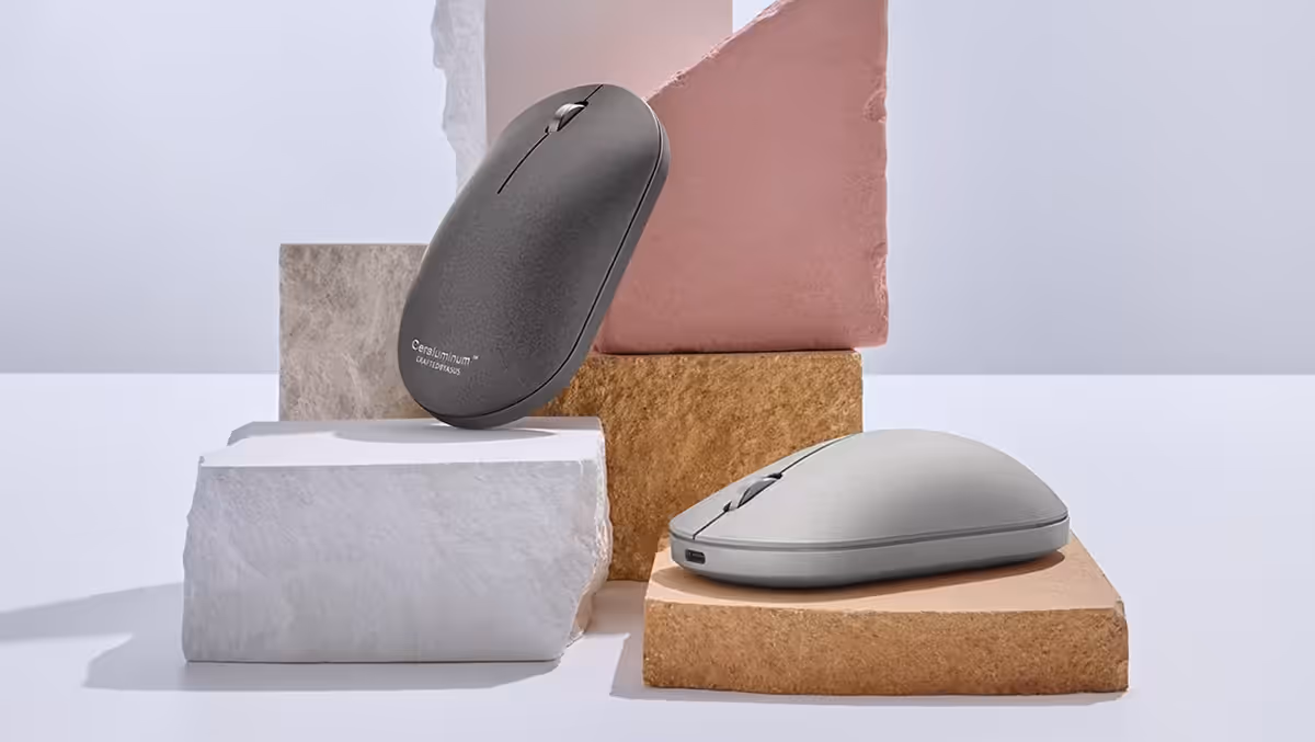Two ASUS ZenMouse devices displayed on stacked stone-like blocks, featuring the exclusive Ceraluminum™ cover.
