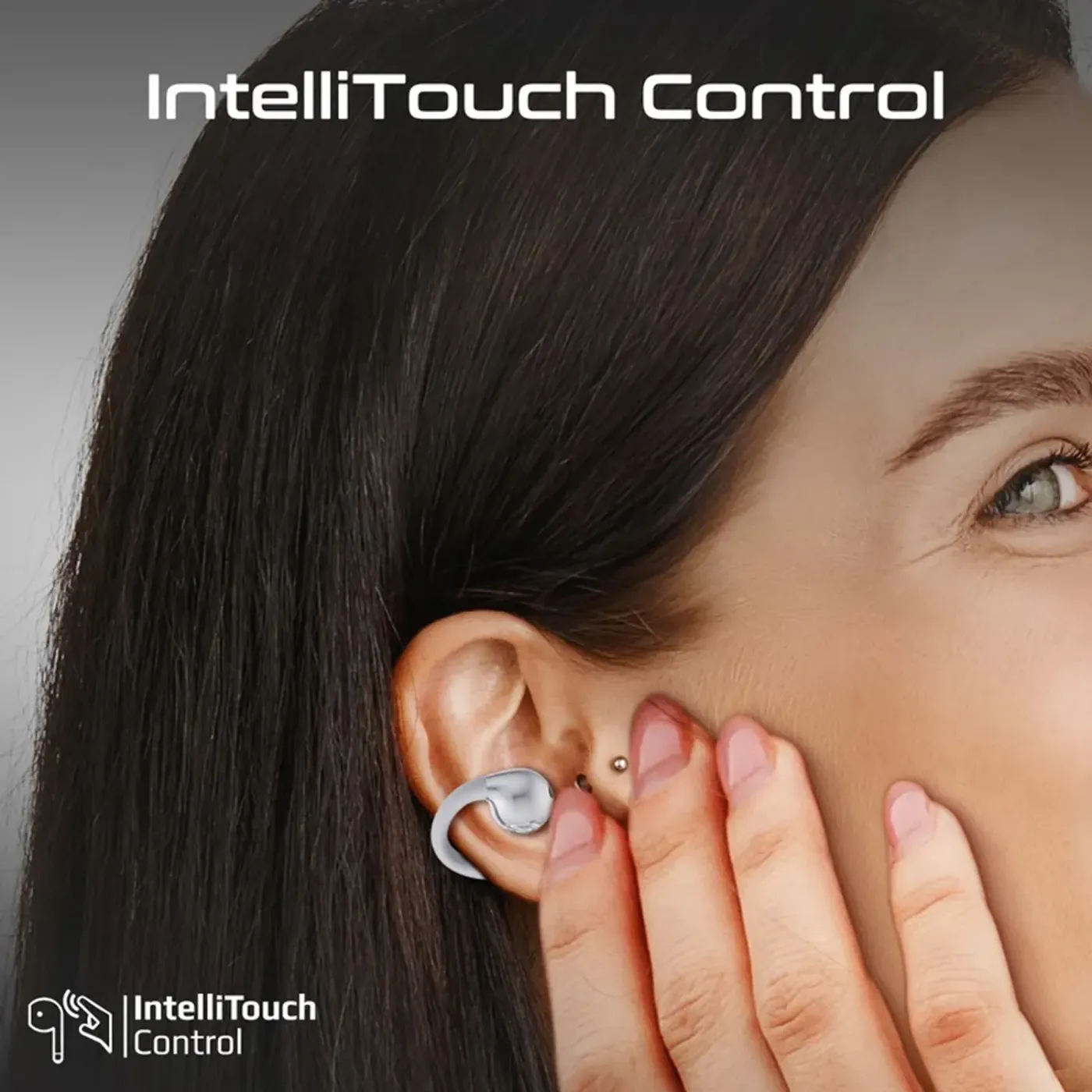 Close view of the touch control area on the white AudioFit clip-on earbud