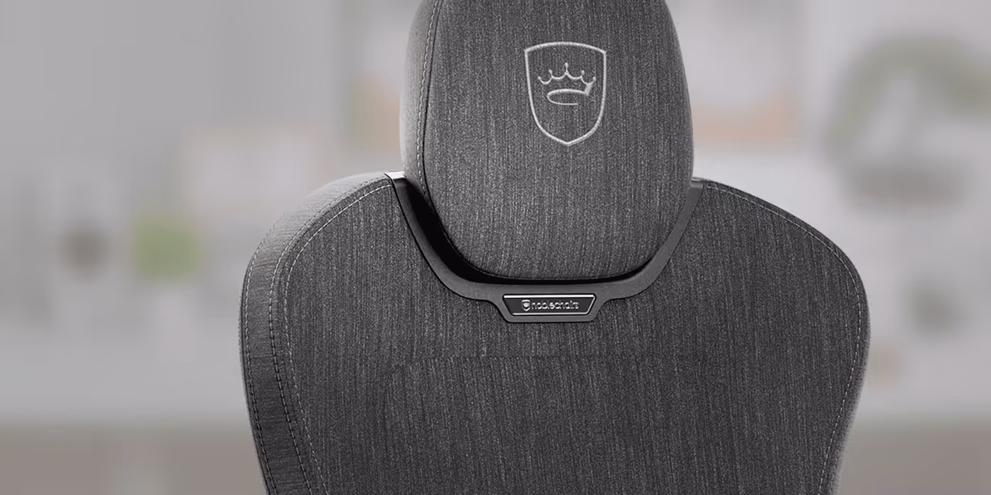 Close-up view of the breathable fabric upholstery and soft texture of the AURA TX chair