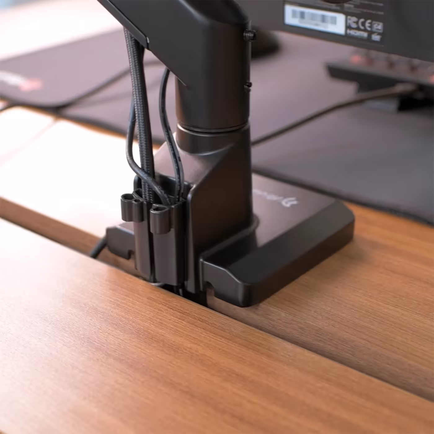 Adjustable split tabletop showing gap for monitor arm mounting and cable routing