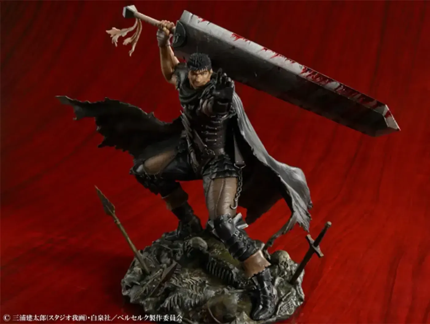 Back view of the Berserk Guts figure showing the dynamic pose