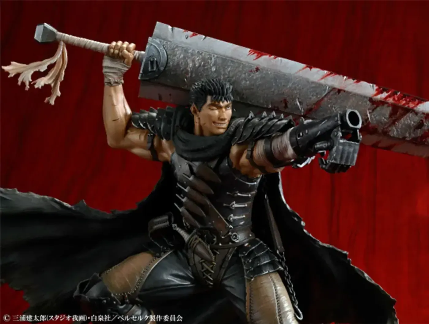 Berserk Guts figure demonstrating its pose on the supplied pedestal