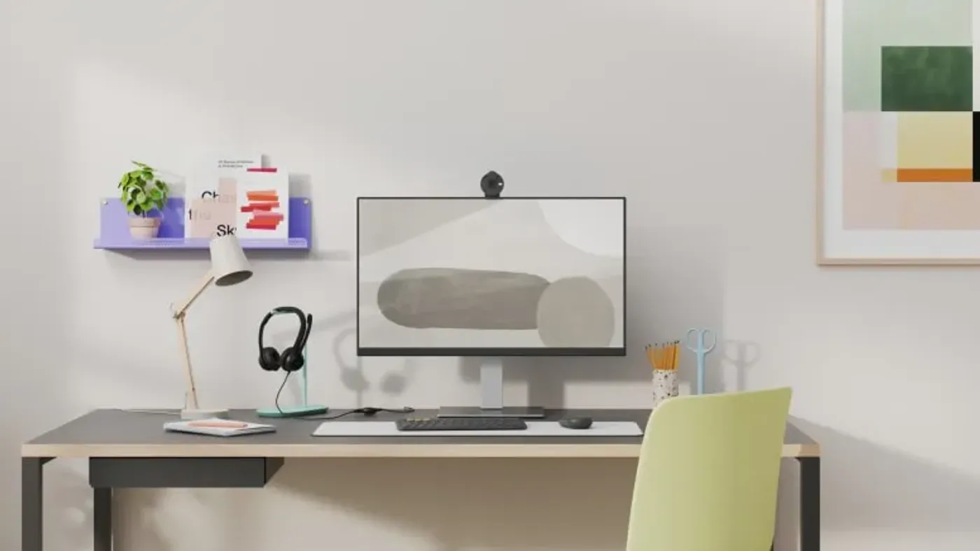Logitech workspace setup including headset, webcam, and peripherals