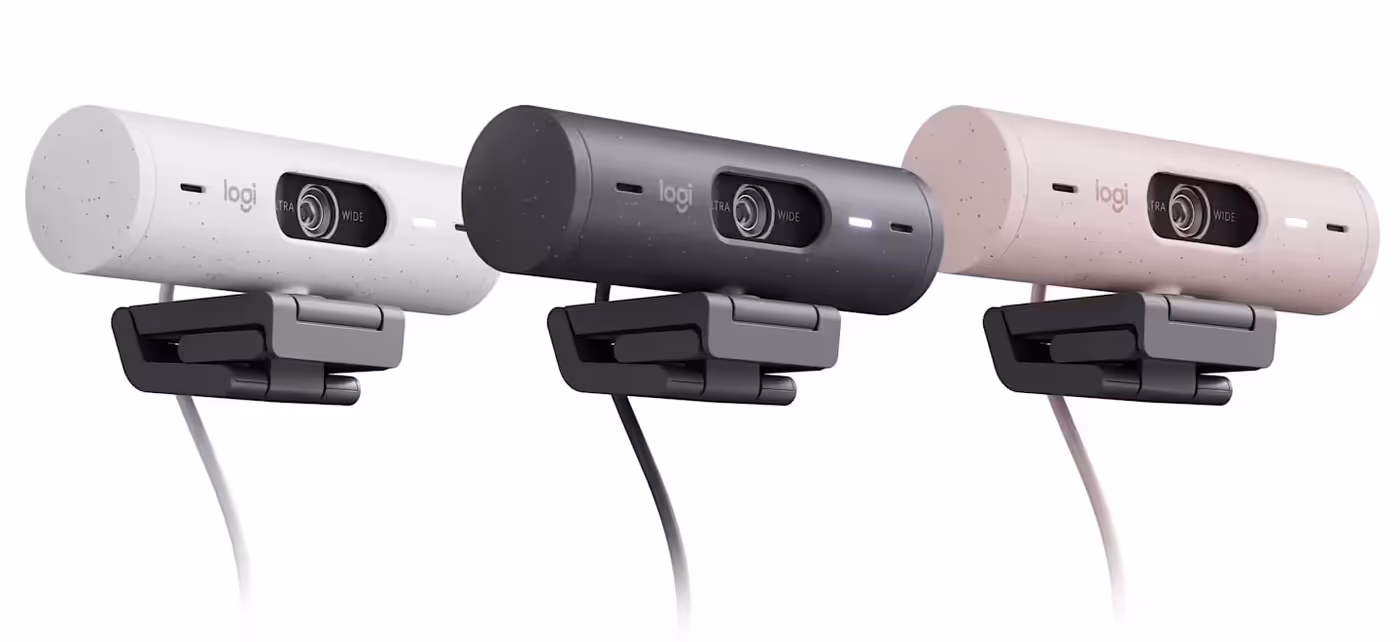 Webcam positioned on a desk setup for hybrid meetings and video conferencing