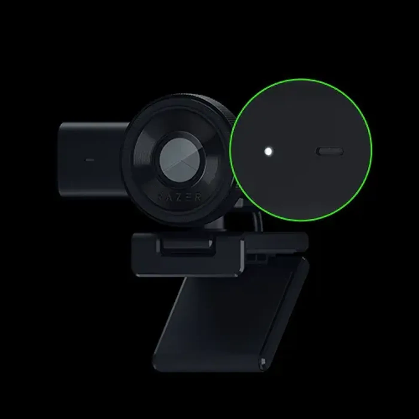 A black Razer gaming camera with a clip, featuring a large lens, a circular green-lit indicator, and a sleek, modern design.
