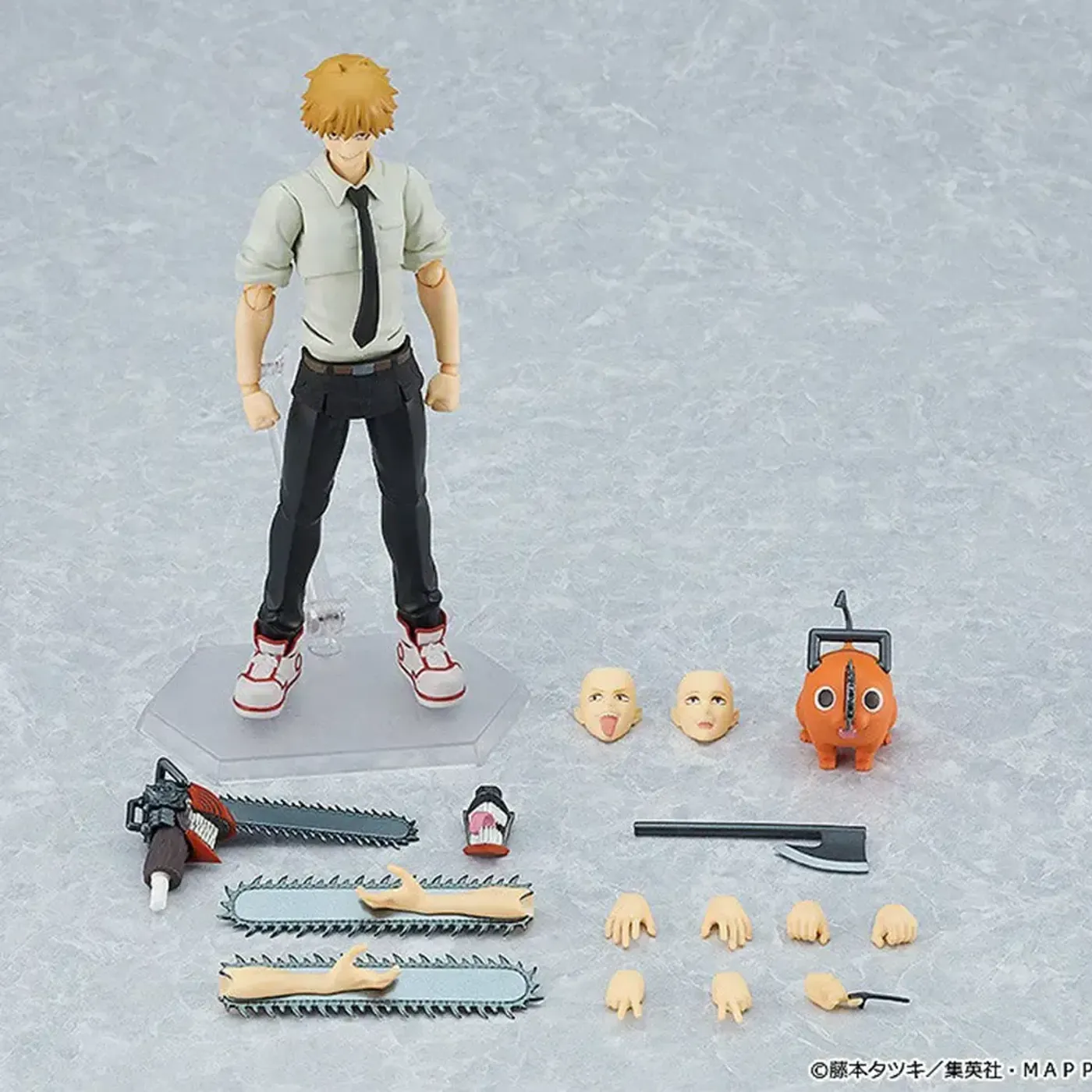 The Denji Figma figure posed in a dynamic and action-packed display configuration