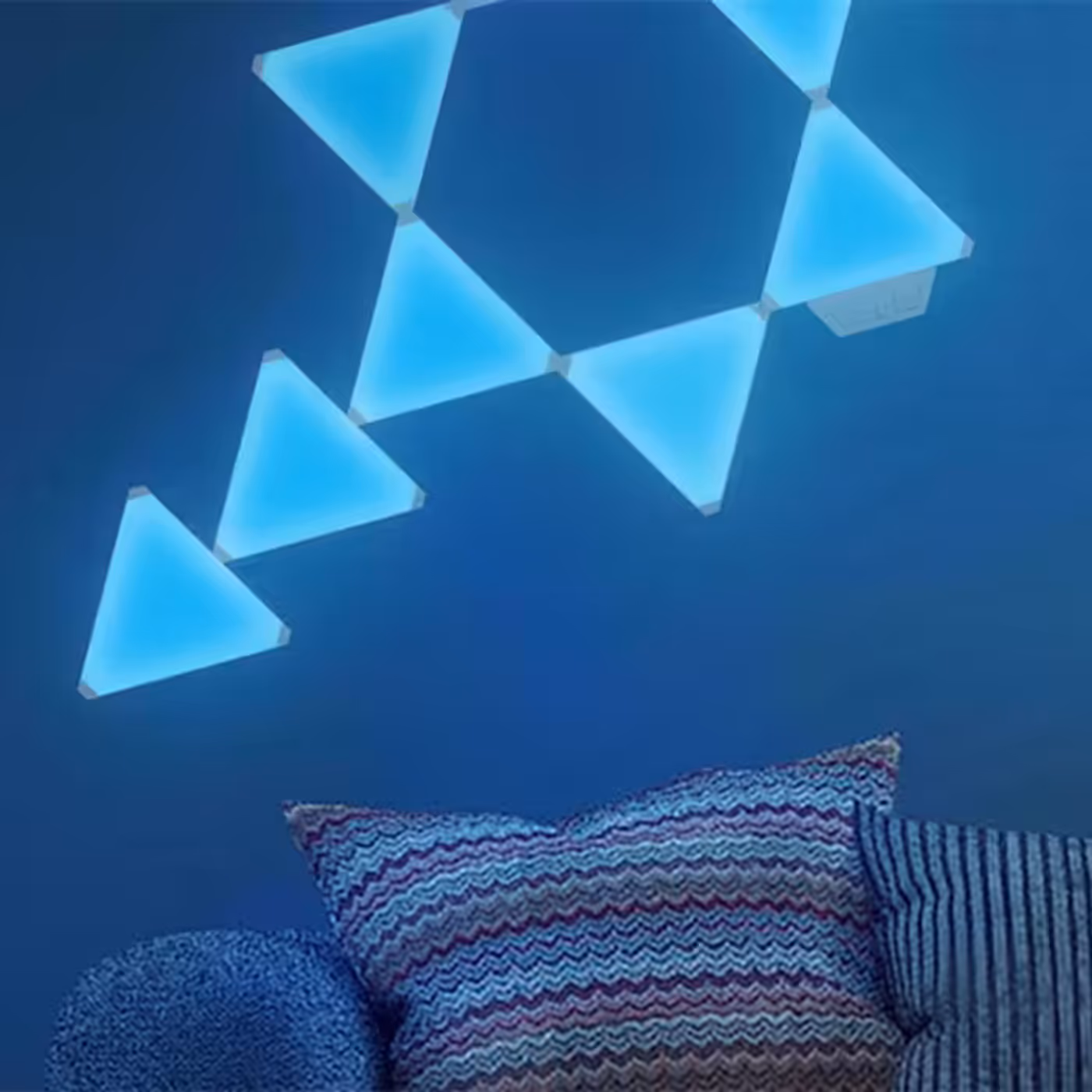 Cololight Triangle panels arranged into a lit wall pattern