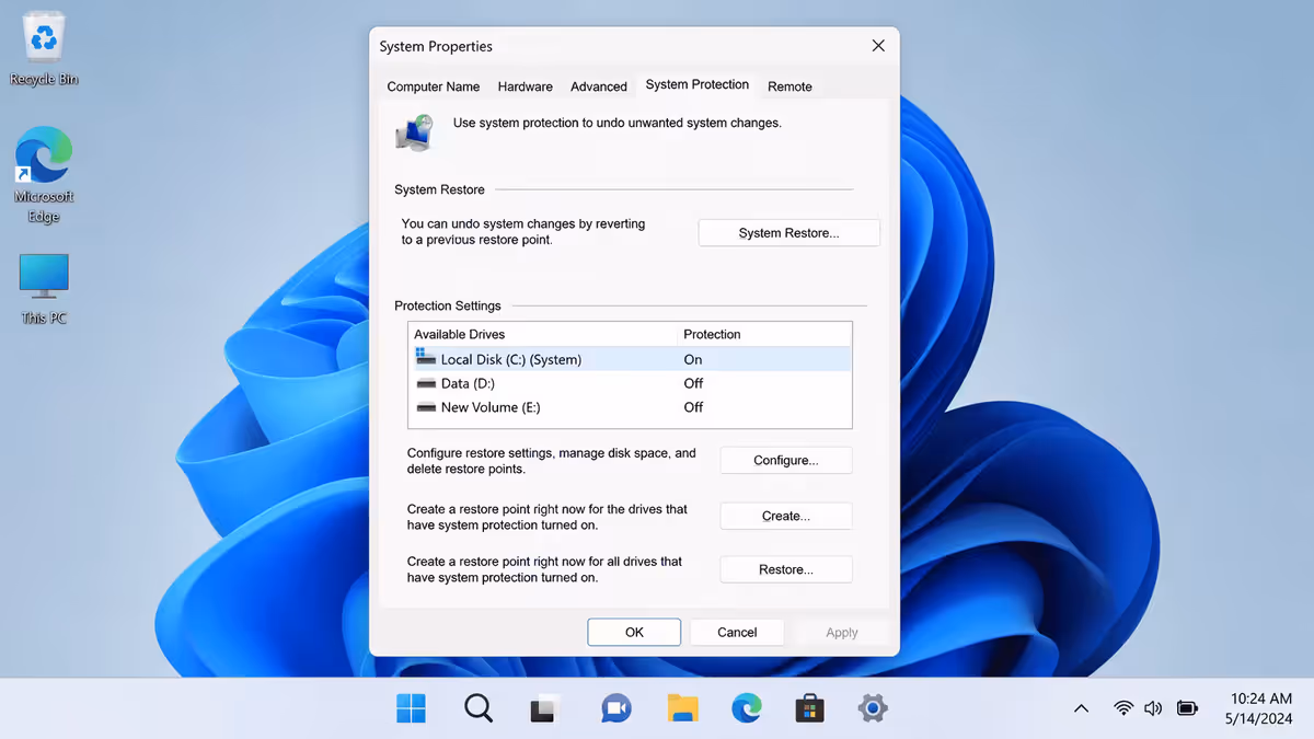 System Properties → System Protection tab on Windows 11