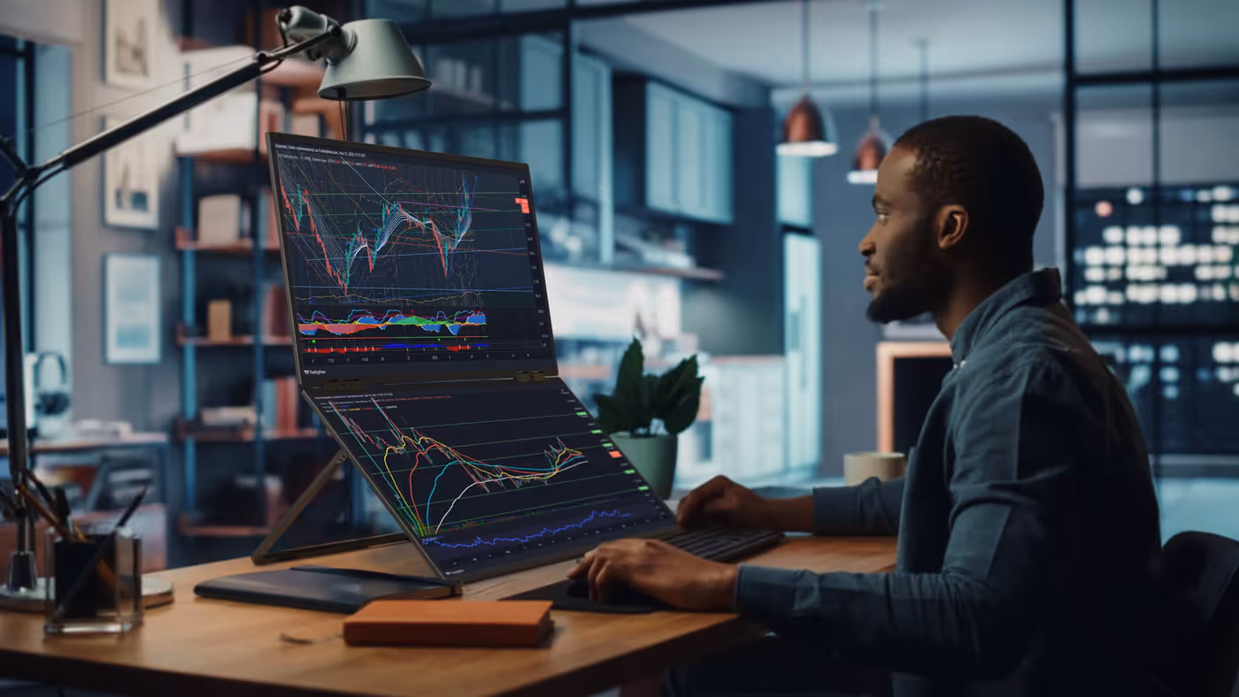 Modern dual-screen stacked monitor setup for desk space optimization