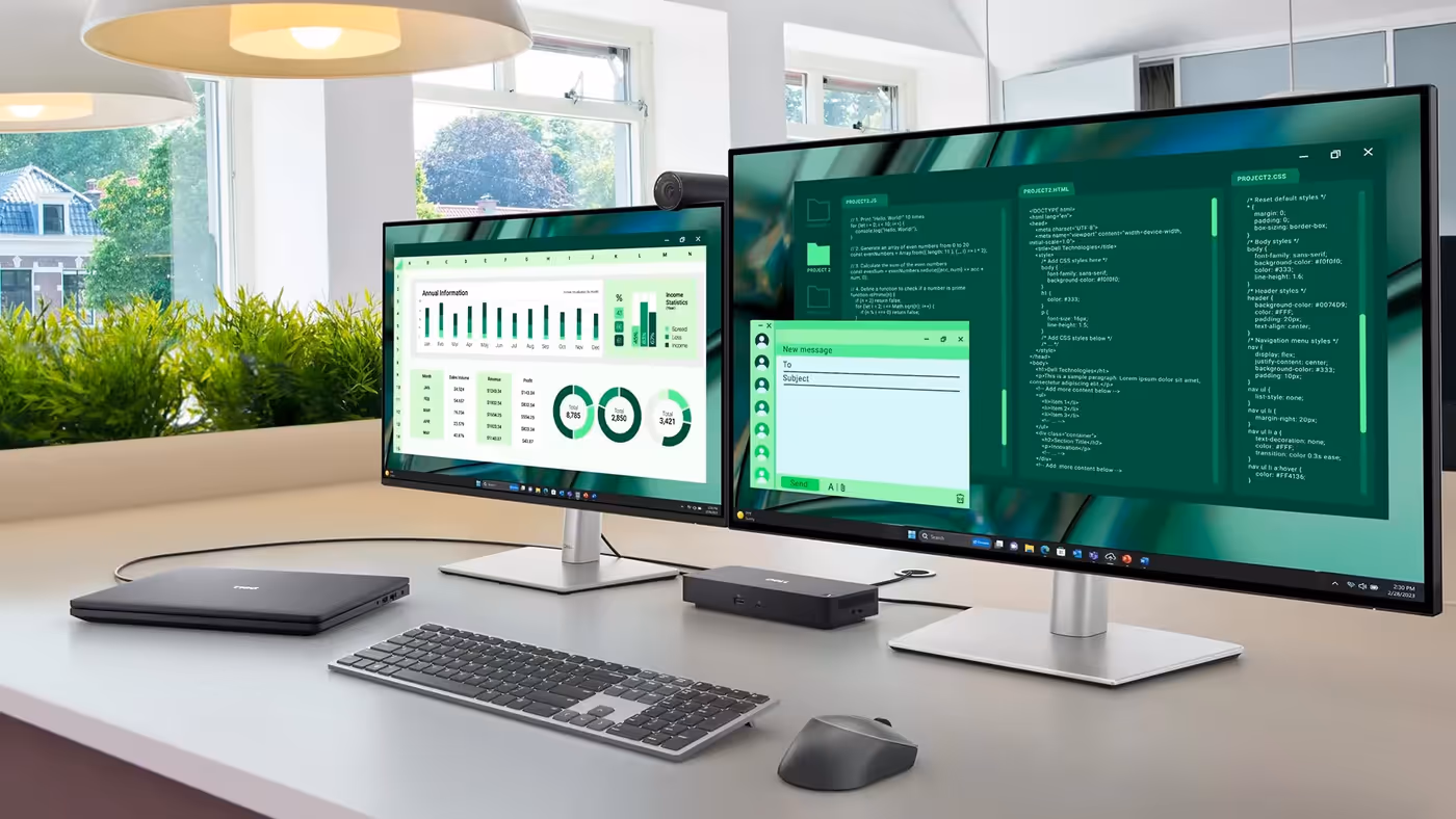 Two monitors on a desk, along with a Dell laptop, connected together by a Dell Pro Dock.