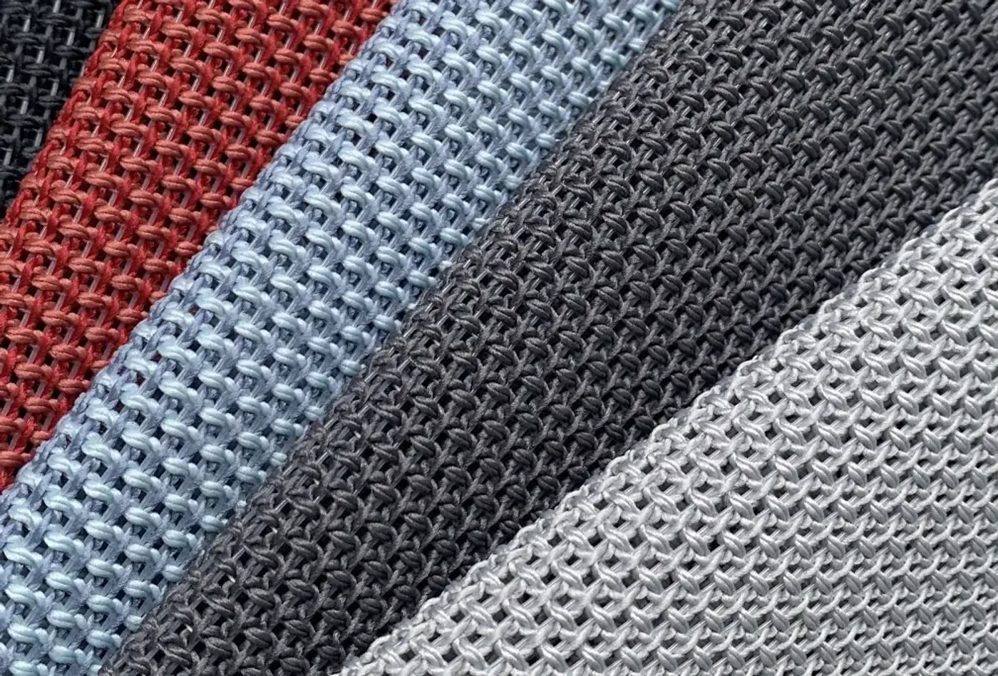 Close-up of the breathable dark grey mesh used on the Enova Aria backrest