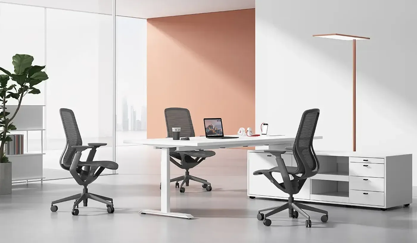 Close-up of the Enova Aria armrests and breathable seat fabric