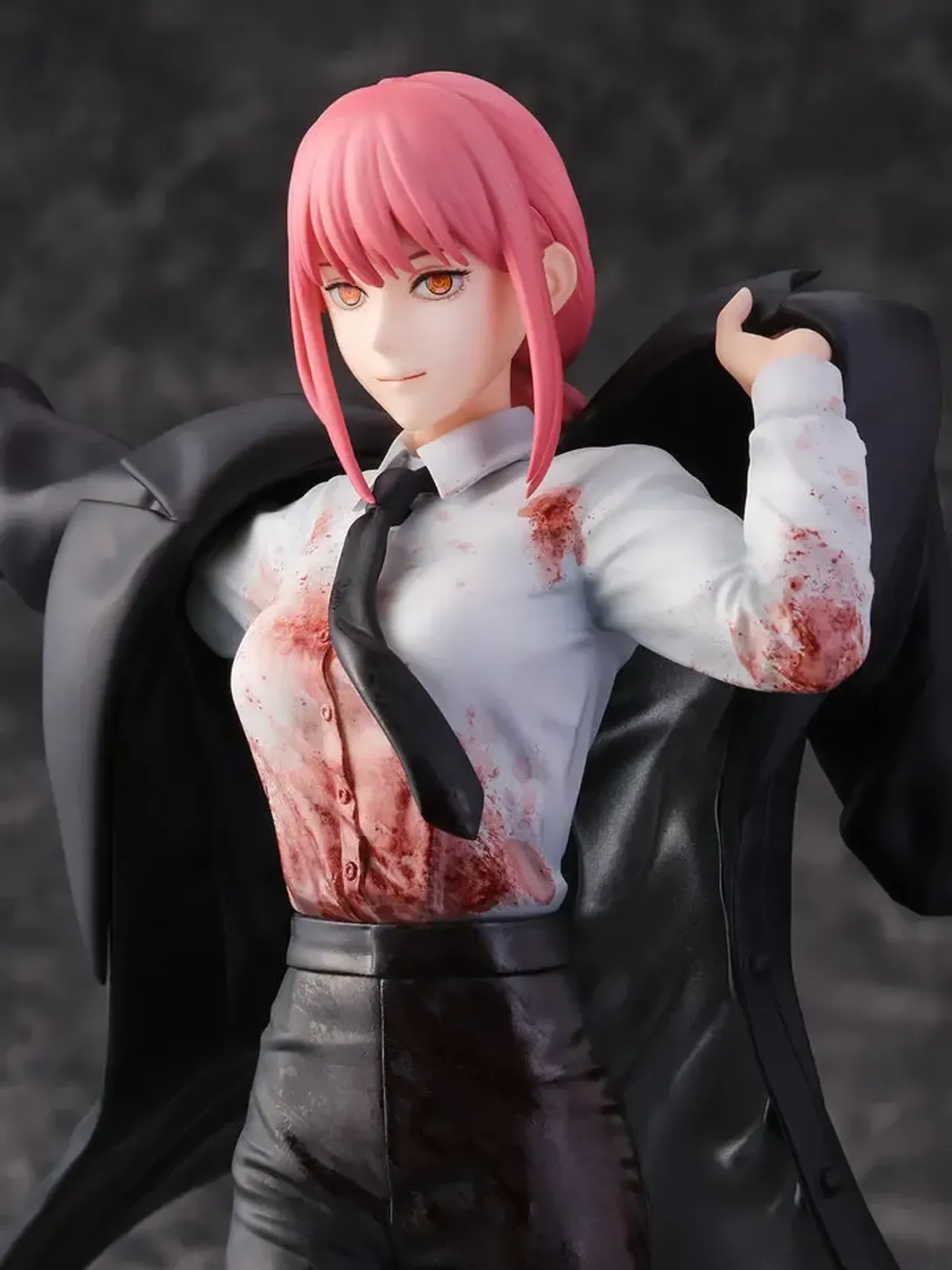 Close-up of Makima's hands and arm placement on the figure