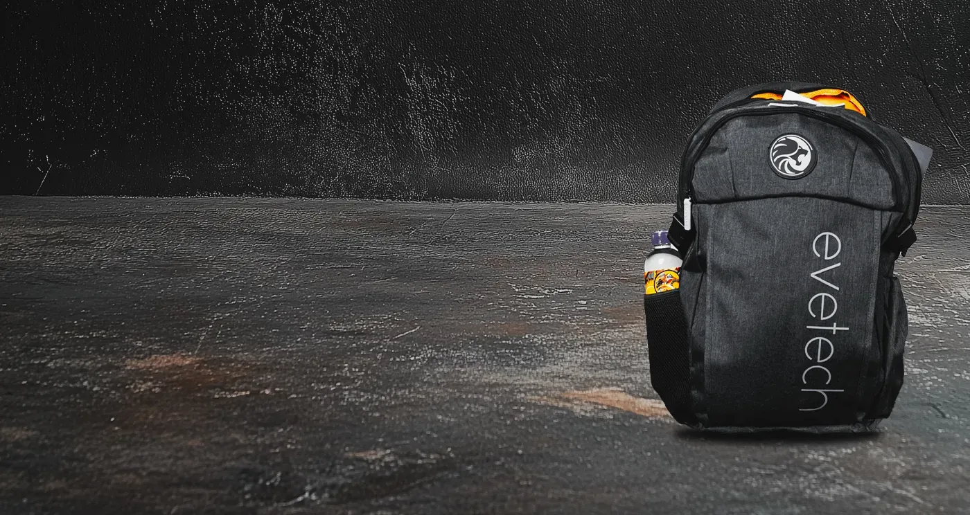 Open main compartment of the Evetech Flux backpack holding a laptop and notebooks