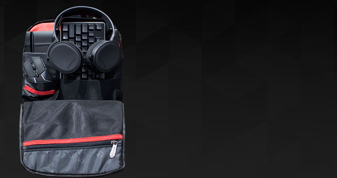 Evetech NEO backpack packed with a headset, mouse, keyboard and cables