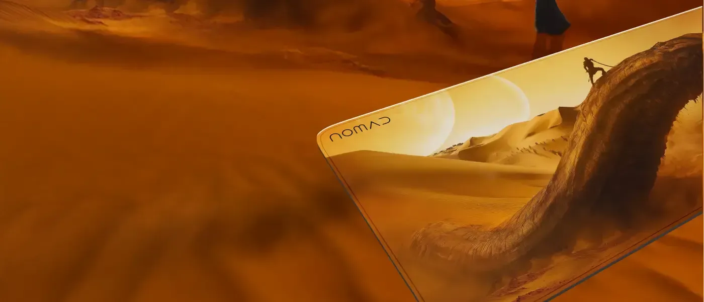 Desertscape artwork with towering sand creatures on the Evetech Nomad mousepad