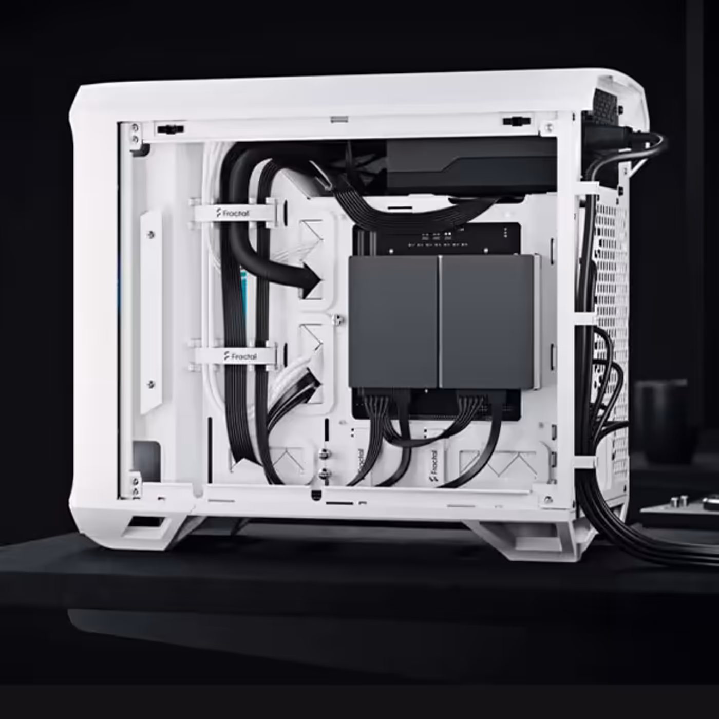 Internal layout showing cable management clips and SSD storage brackets