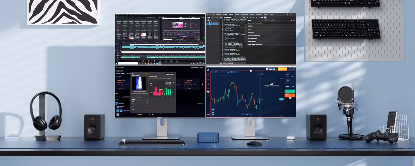 GEEKOM IT13 2026 Edition Mini PC supporting a multi-monitor productivity setup
