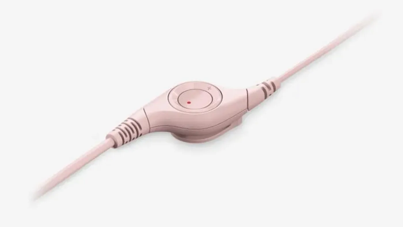 Close-up of the inline volume and mute controls on the headset cable