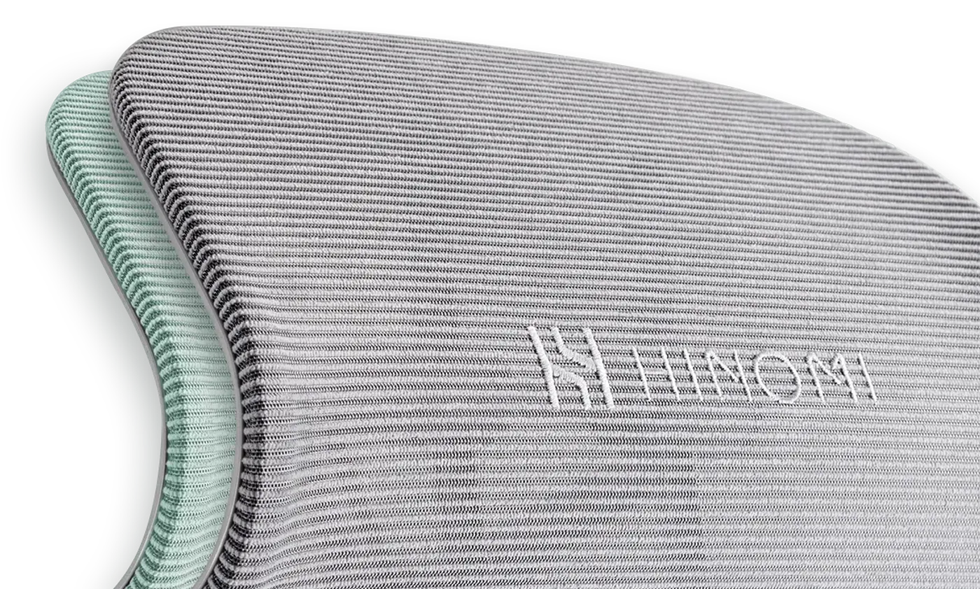 Close-up of the breathable hybrid mesh material on the chair's backrest