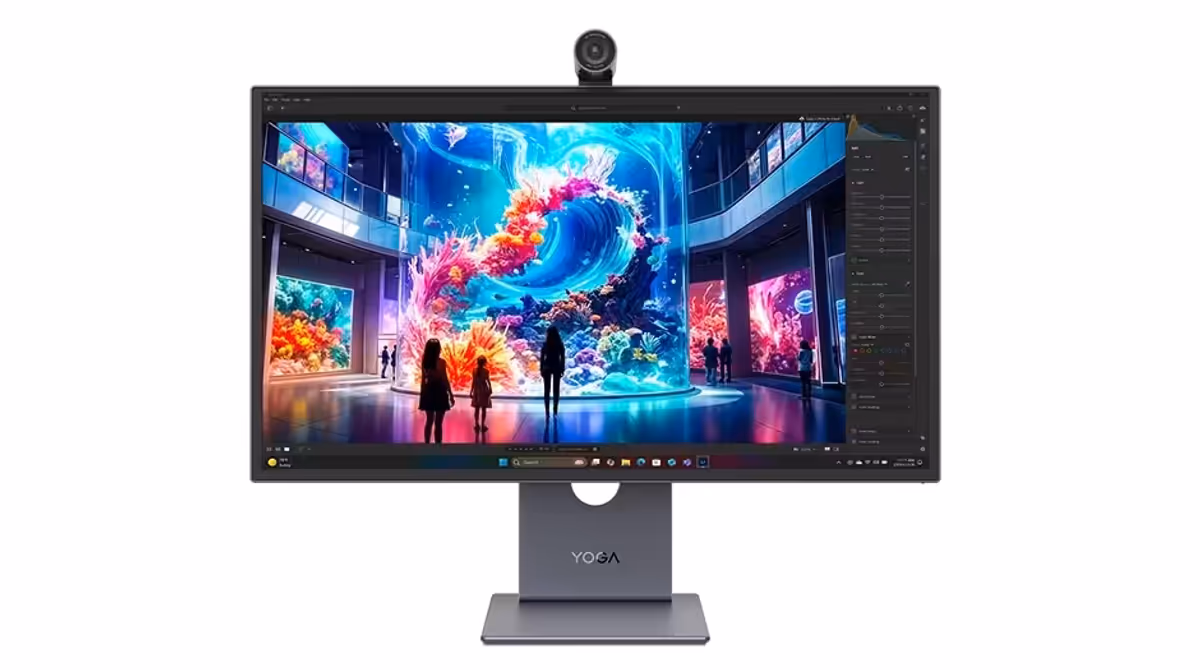 Front view of the Yoga Pro Monitor with silhouetted figures in front of a tank of sealife on the screen.