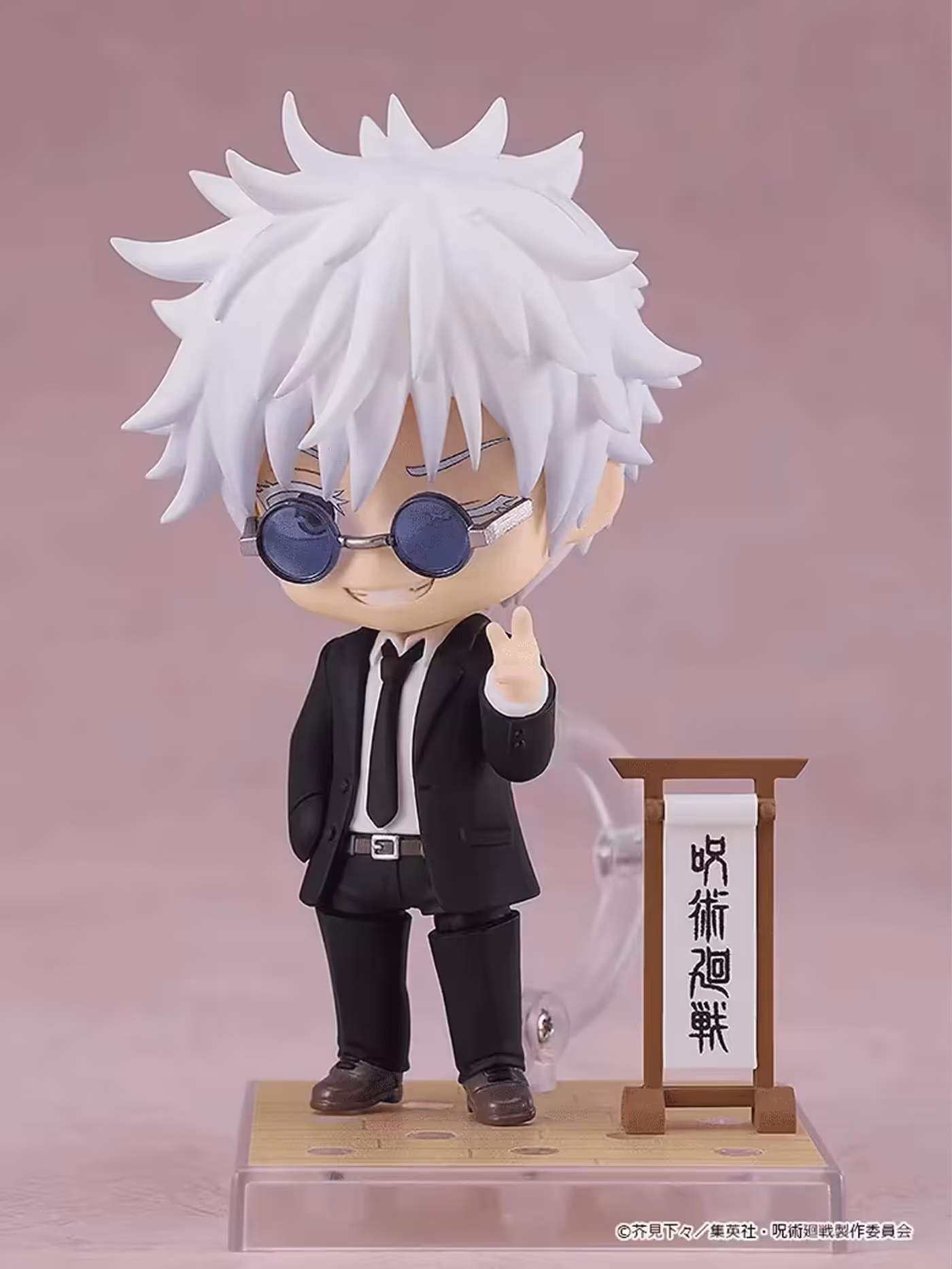 Nendoroid Satoru Gojo in a suit and tie with his winking face plate and display base