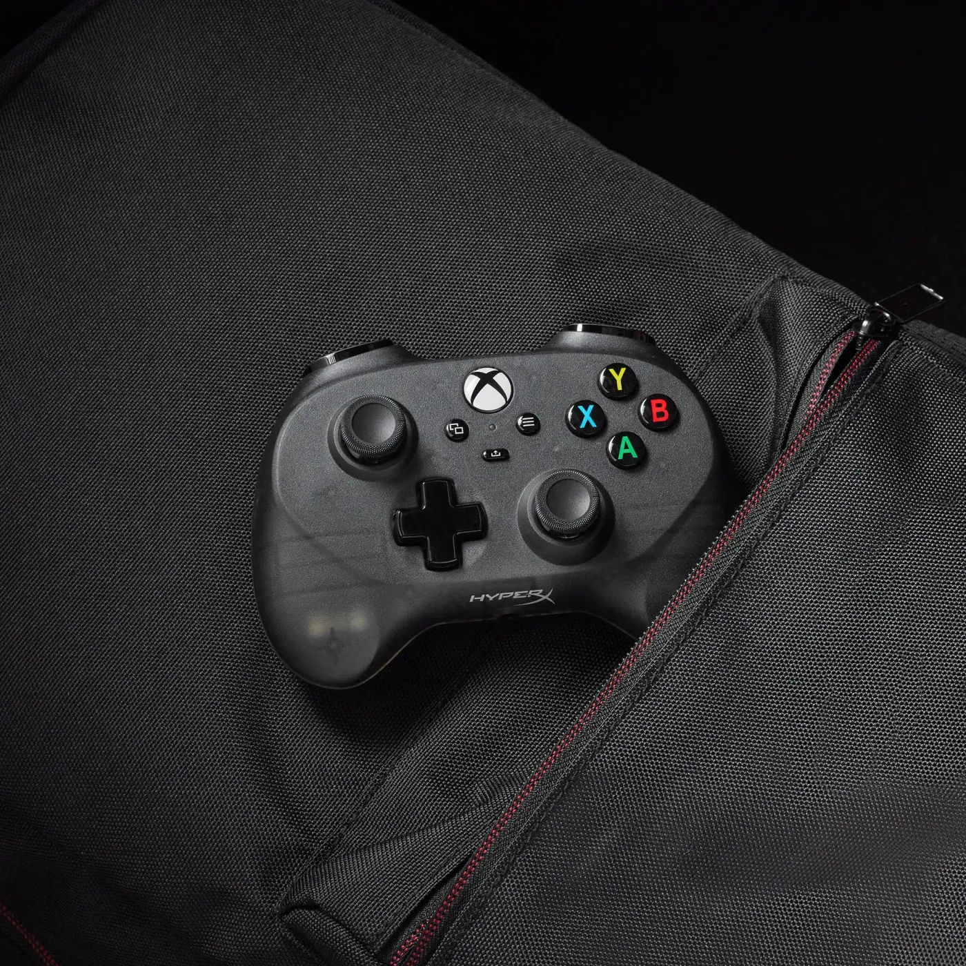 HyperX Clutch Tanto mini controller fitting inside a backpack for portable gaming