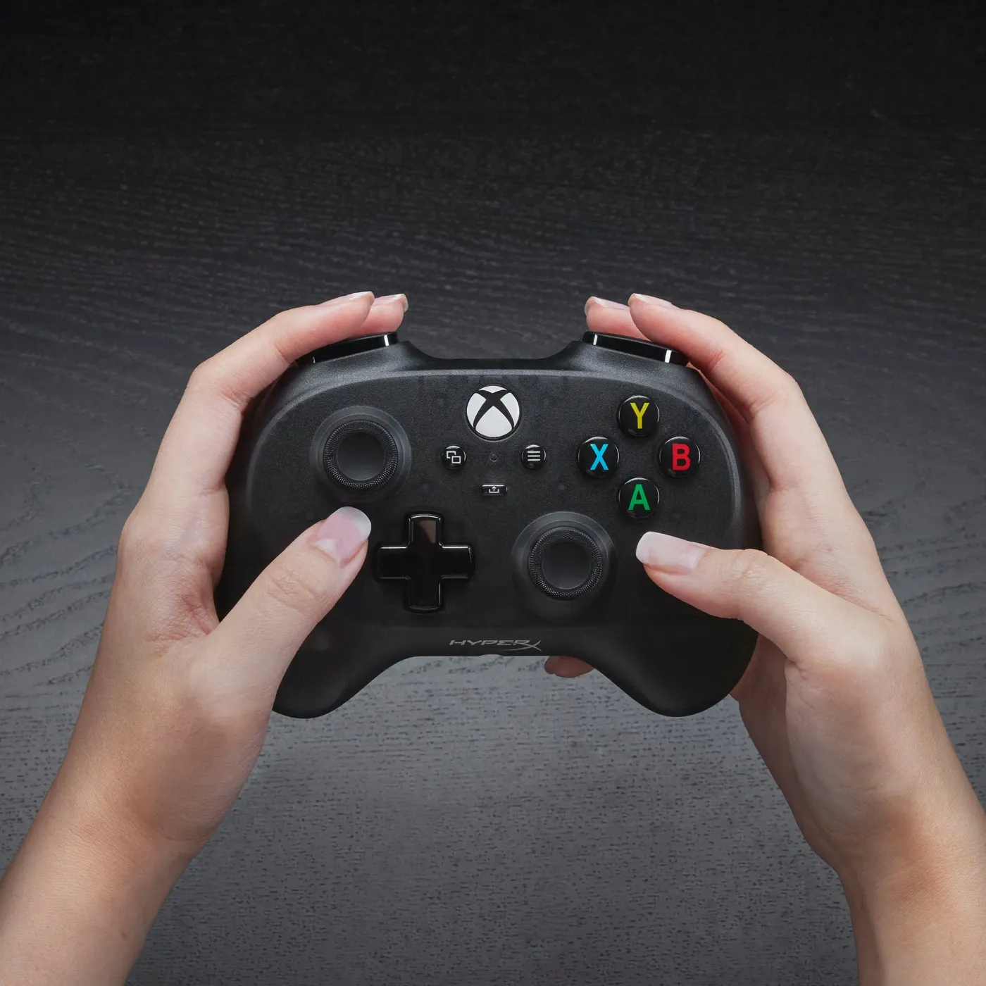 HyperX Clutch Tanto ergonomic mini controller held comfortably in hand during gaming