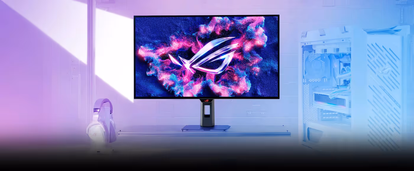 Futuristic desktop setup with ROG OLED monitor displaying vivid pink and blue graphics