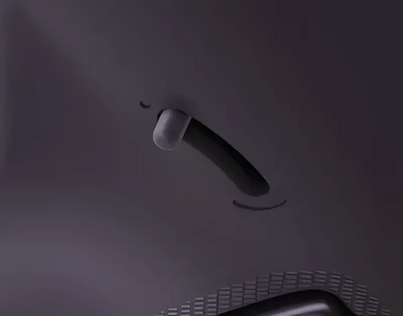 Close-up of the adjustable trigger switch for FPS and racing games