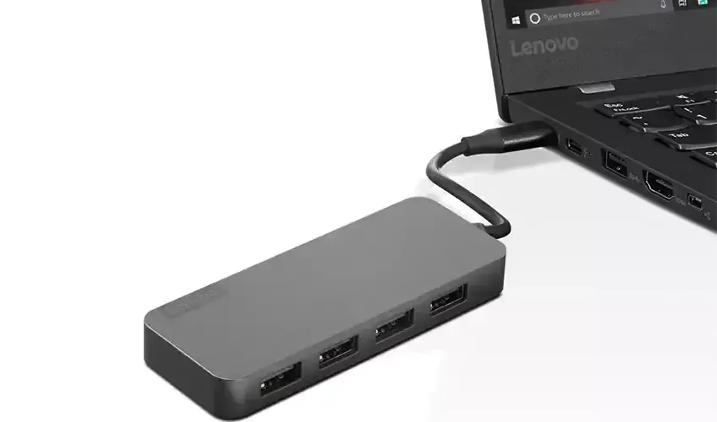Lenovo USB-C to 4-Port USB-A Hub connected to a laptop with peripherals attached
