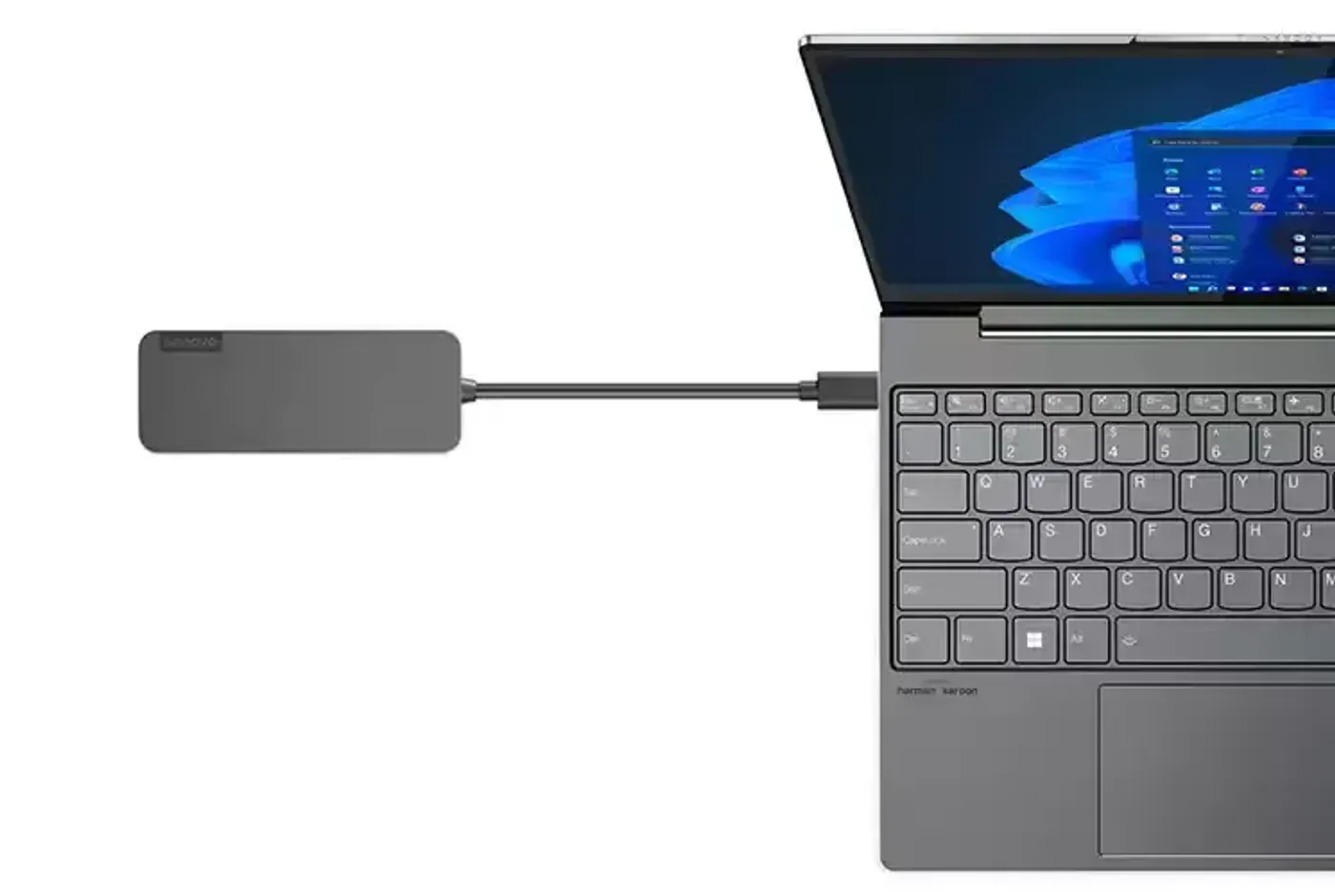 Compact Lenovo USB-C to USB-A hub shown at desk scale with its cable
