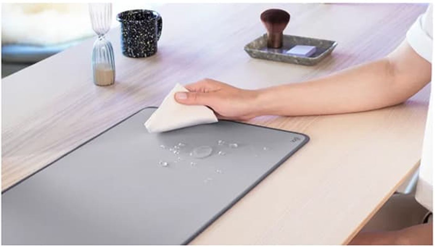 Liquid beading on the spill-resistant surface of the Logitech Desk Mat