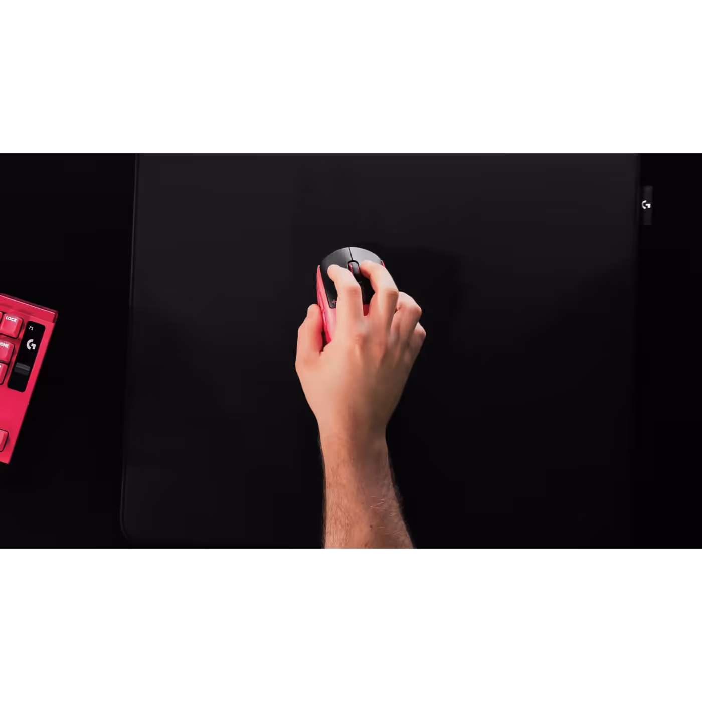 Hand on the PRO X3 SUPERSTRIKE in magenta eclipse, top view