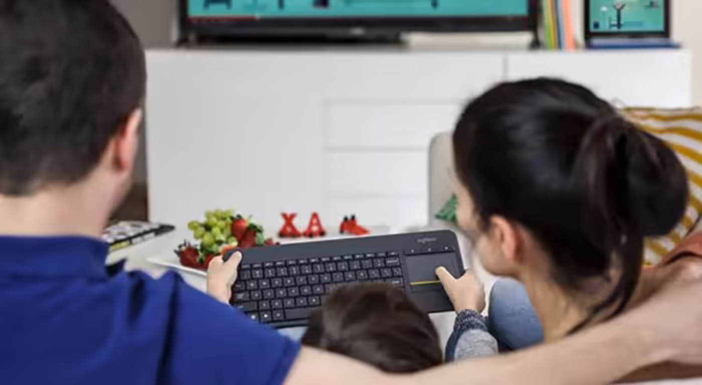 Rear view of the Logitech K400 PLUS keyboard held for couch use