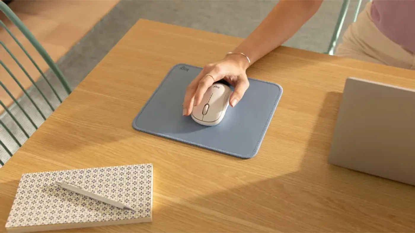 Logitech M240 Silent mouse showing compact portable and ambidextrous design