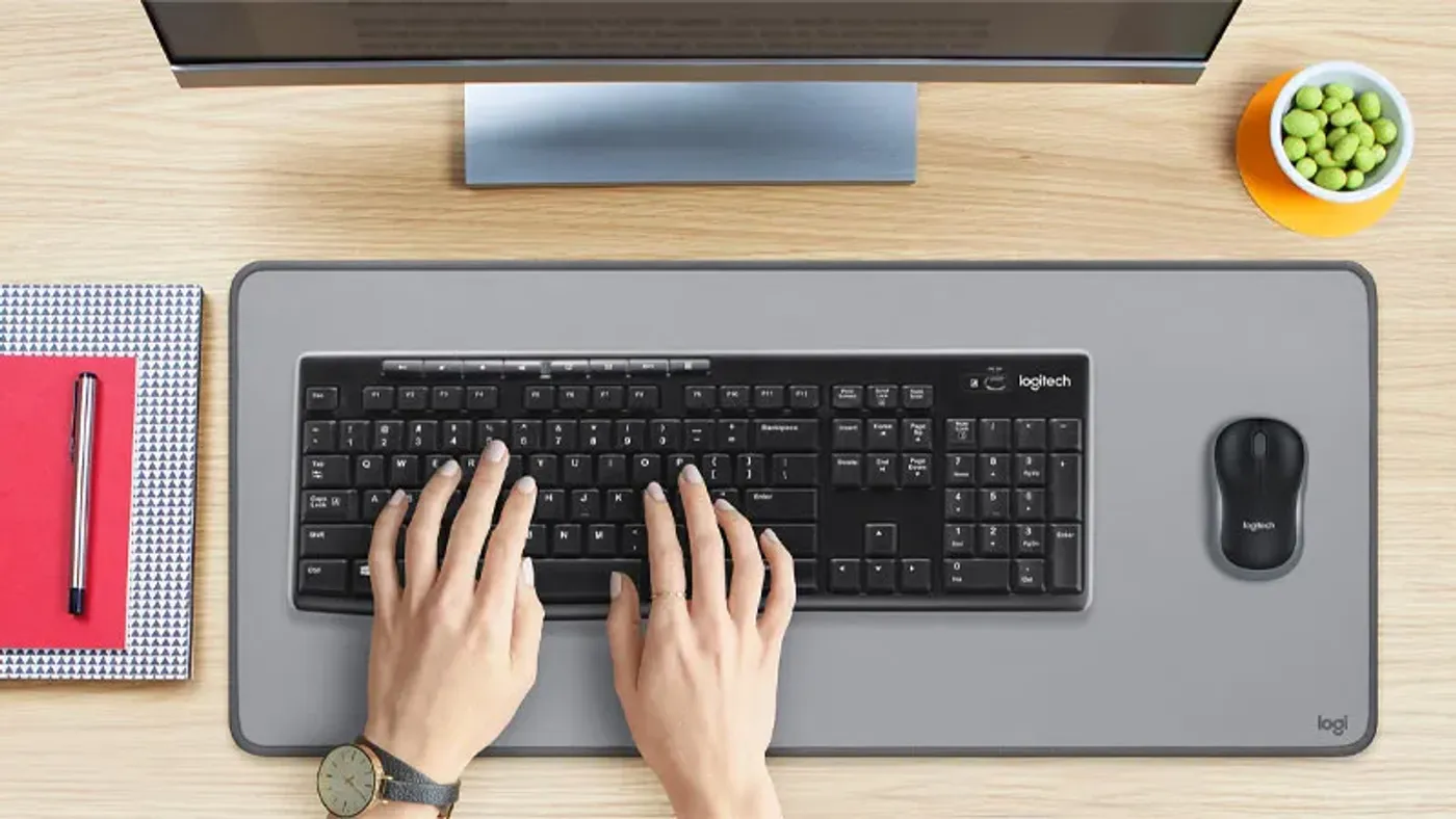 Contoured compact mouse designed for ambidextrous use