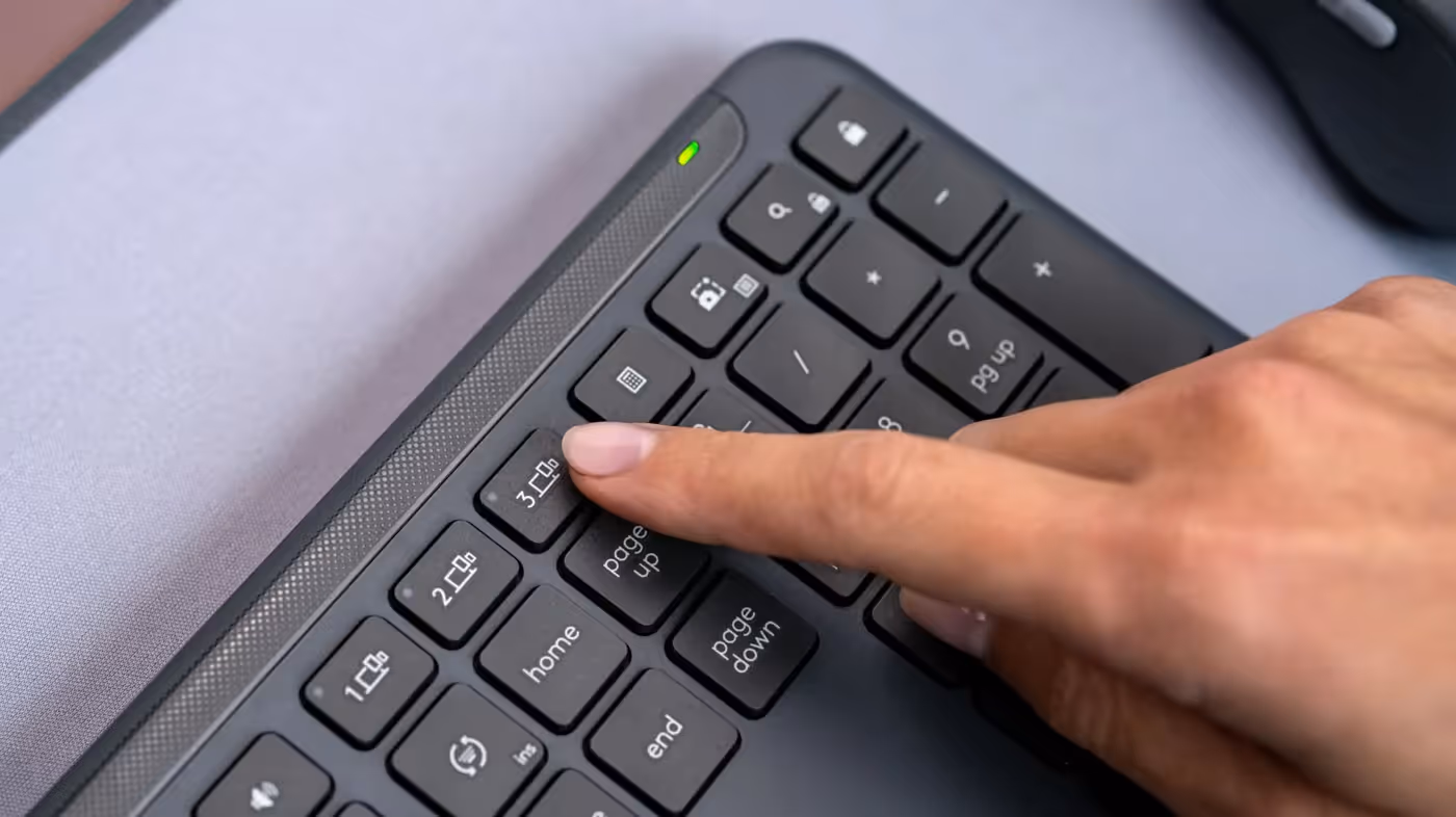 Keyboard switching connection between laptop, tablet, and phone