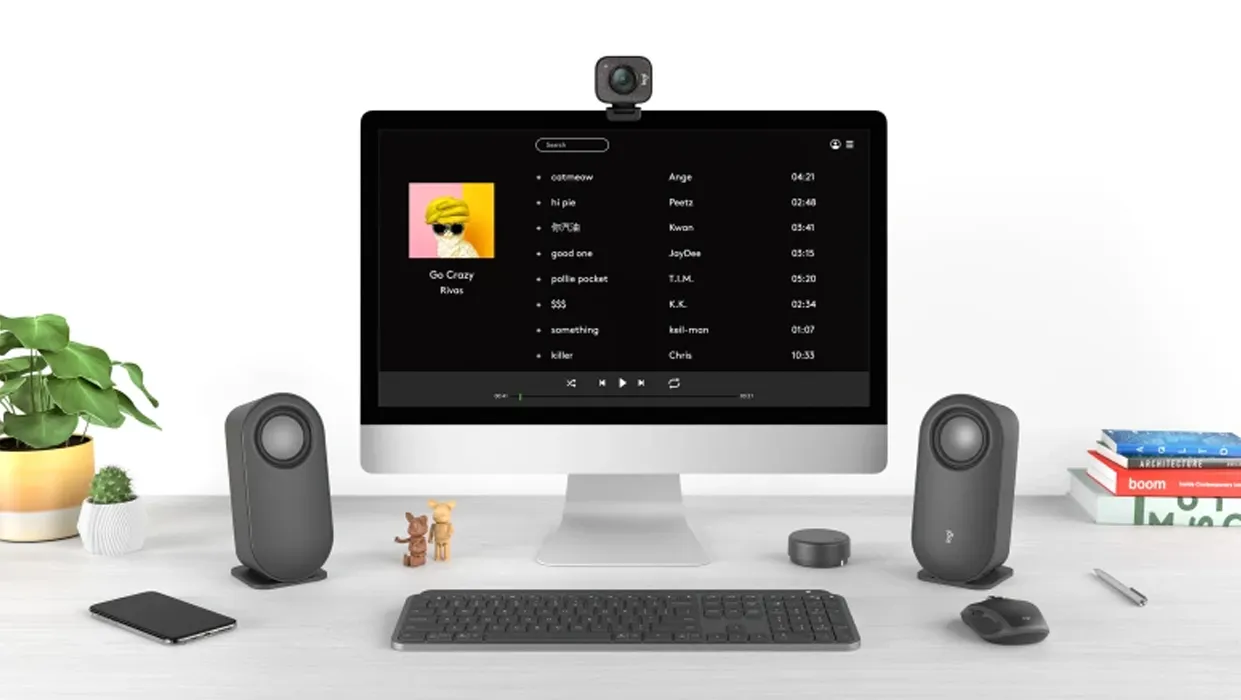 Logitech Z407 oval speakers positioned horizontally under monitor
