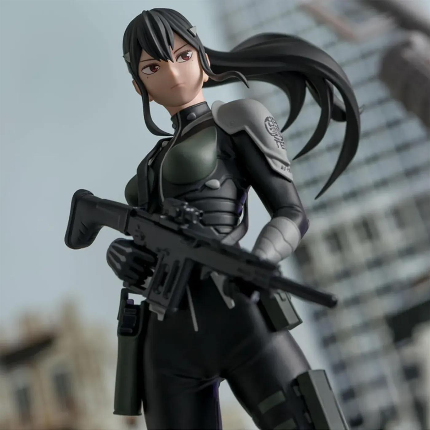 Close-up of the Luminasta Mina Ashiro figure holding her assault rifle