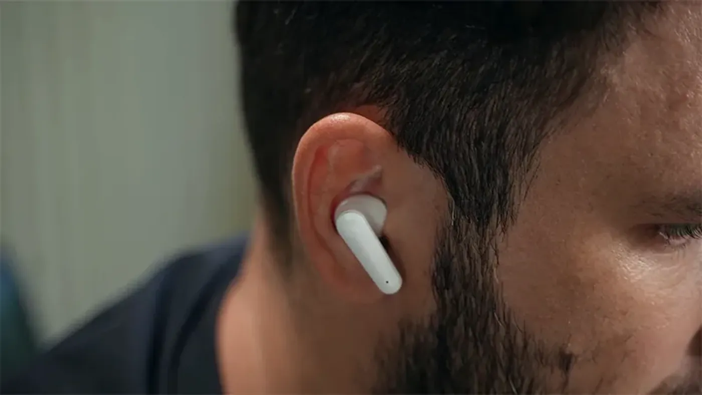 Close view of the touch control surface on a TS9389 earbud