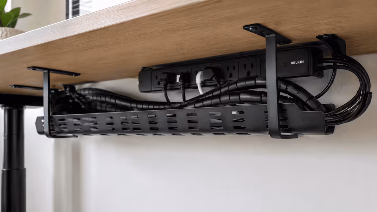 Under-desk cable management close-up